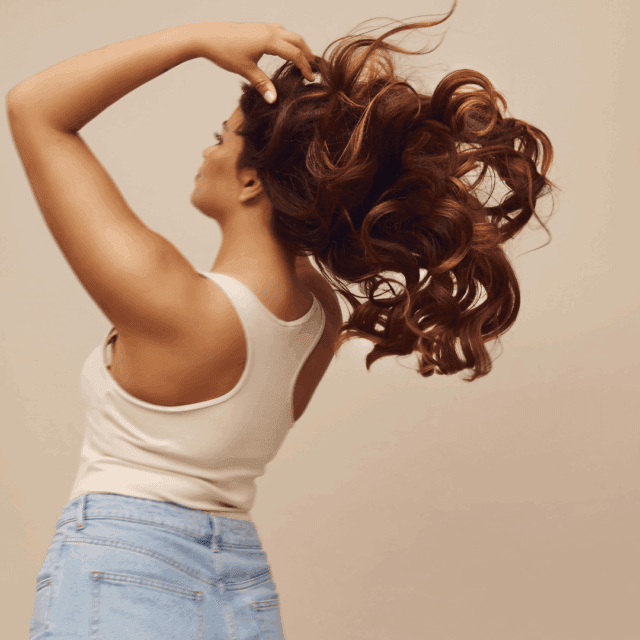 How do exosomes stimulate hair regrowth?